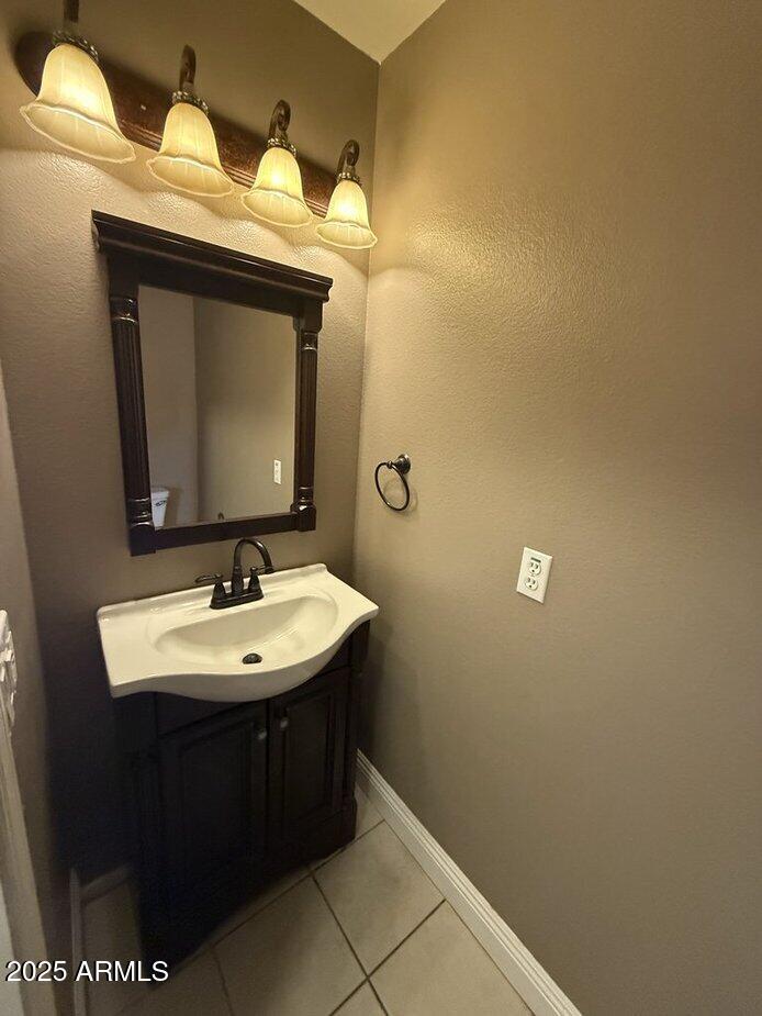 6079 West Irma Lane Glendale, AZ 85308 - Photo 11 of 33 a bathroom with a sink and a mirror