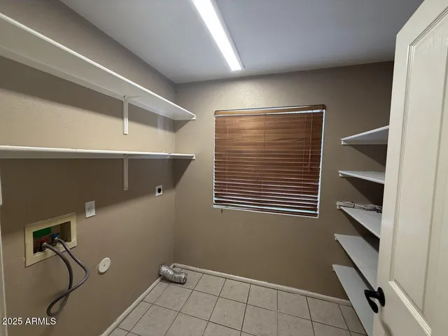 a view of storage and utility room with washer and dryer