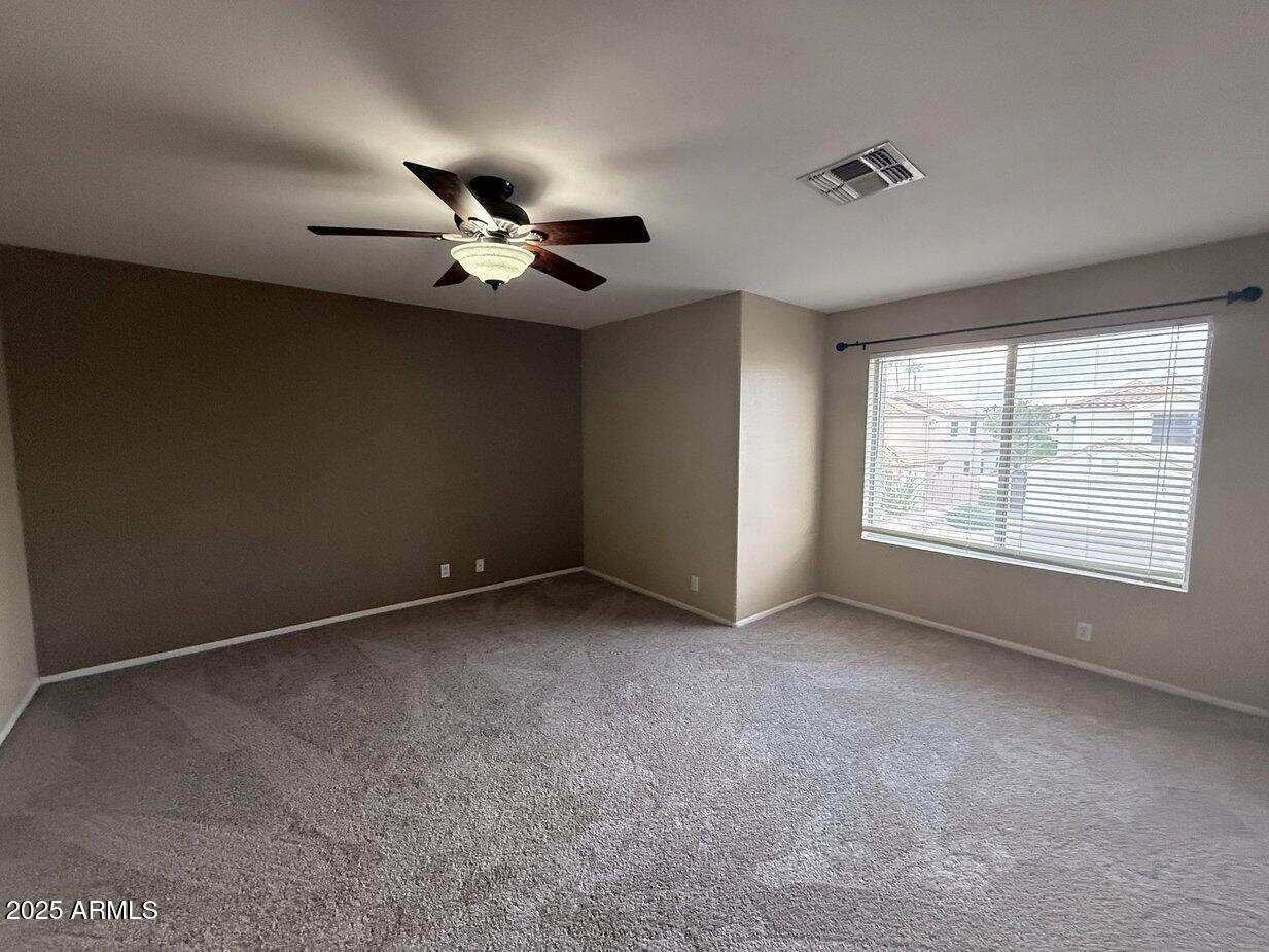 6079 West Irma Lane Glendale, AZ 85308 - Photo 16 of 33 a view of an empty room with a window