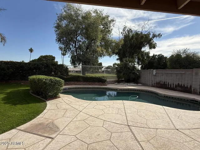 a view of backyard with green space
