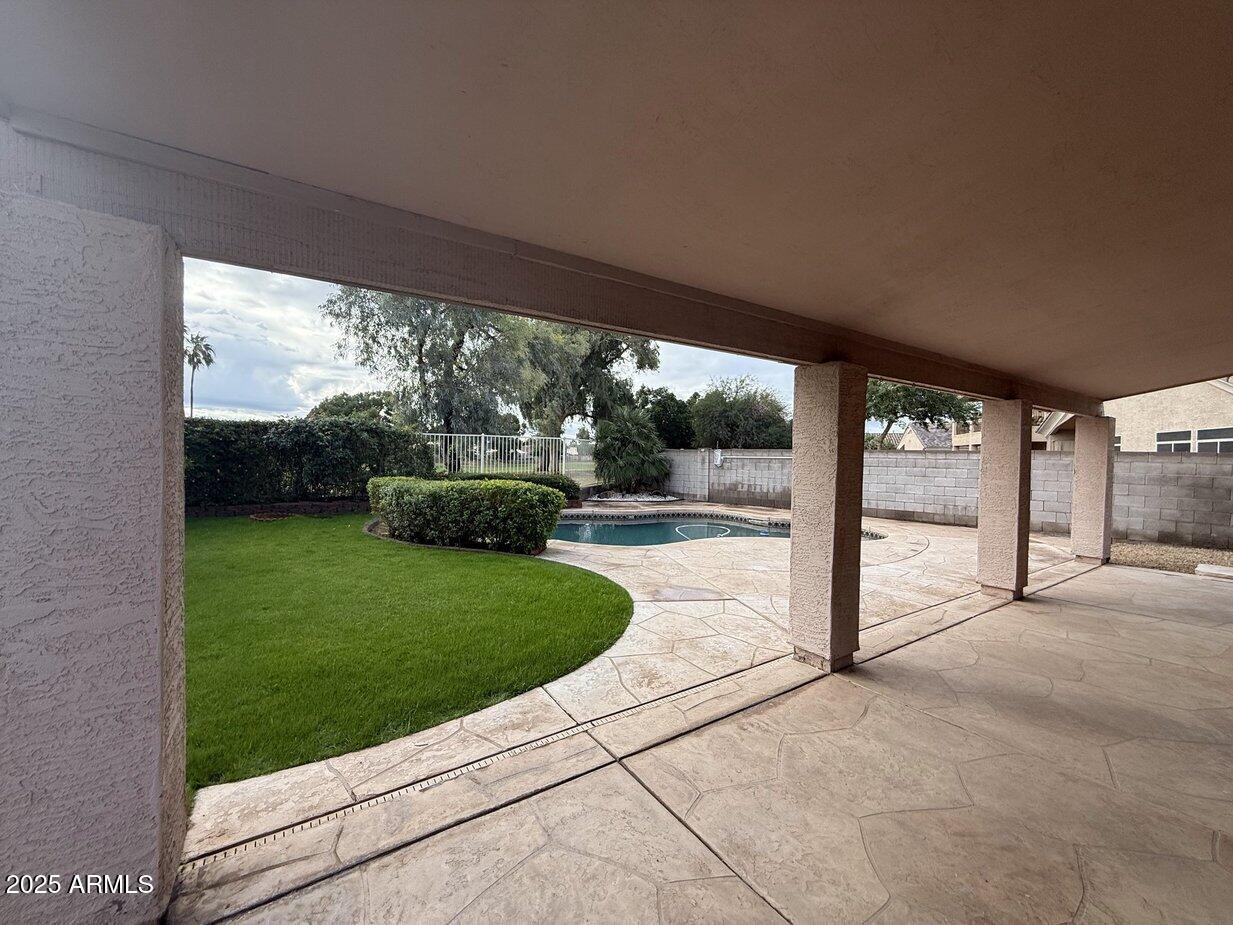 6079 West Irma Lane Glendale, AZ 85308 - Photo 24 of 33 a view of a porch with a backyard