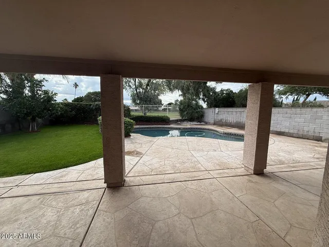 a view of swimming pool from a yard