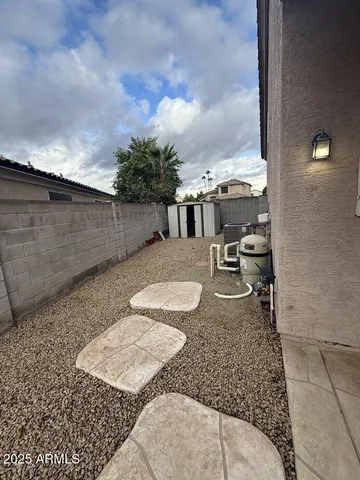 swimming pool view with a sitting space