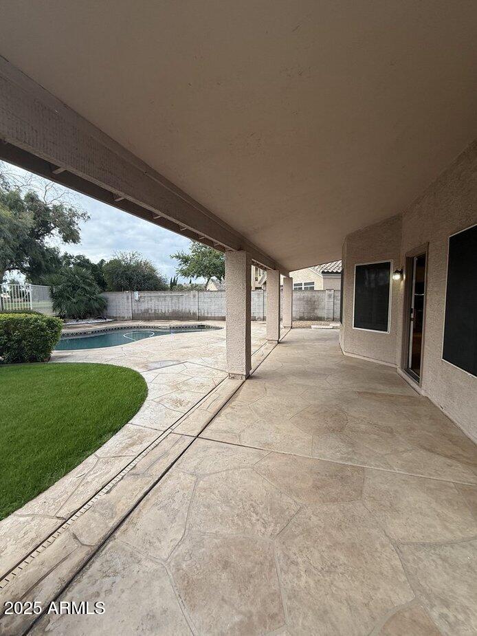 6079 West Irma Lane Glendale, AZ 85308 - Photo 32 of 33 a view of a swimming pool and a yard