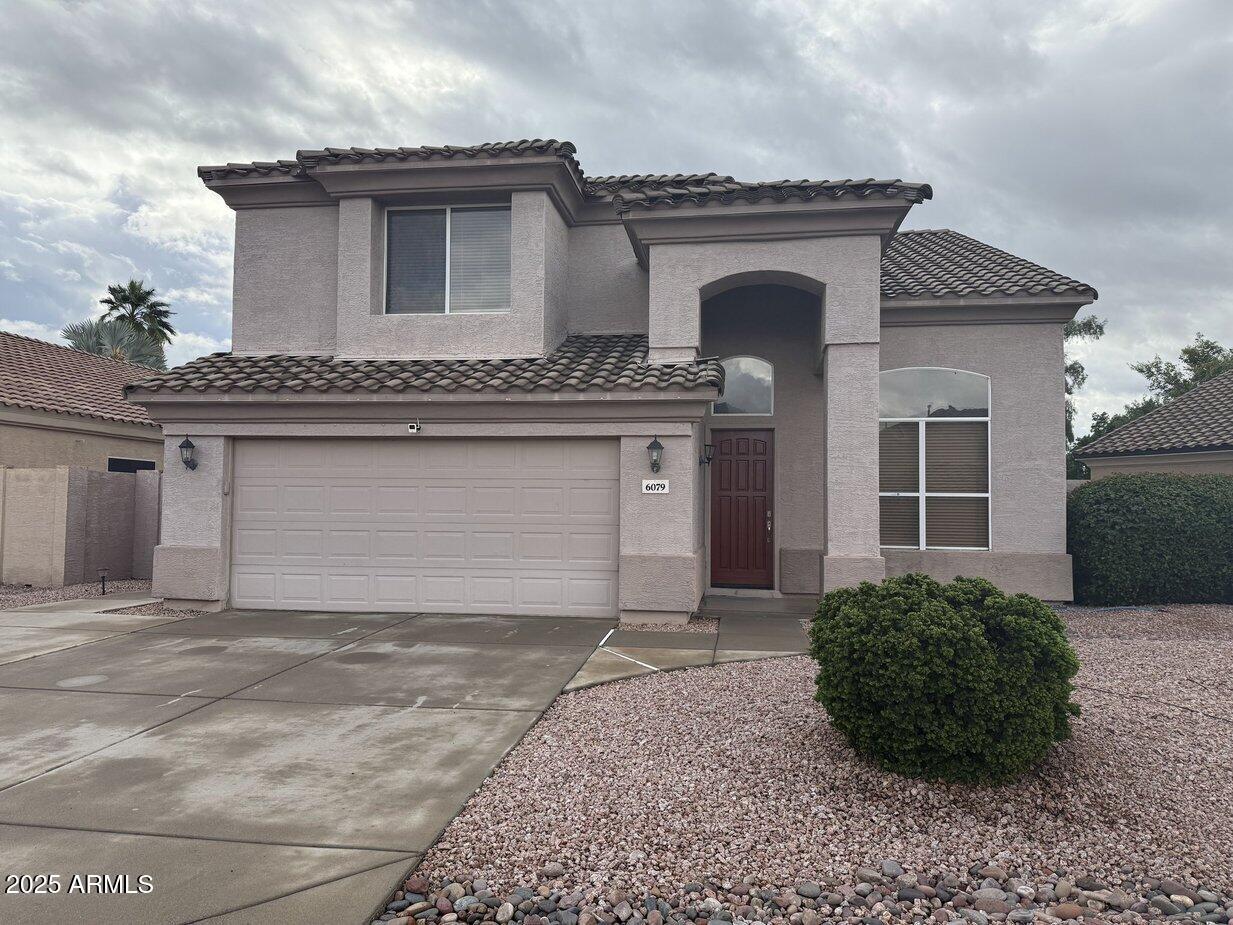 6079 West Irma Lane Glendale, AZ 85308 - Photo 33 of 33 a front view of a house with garden