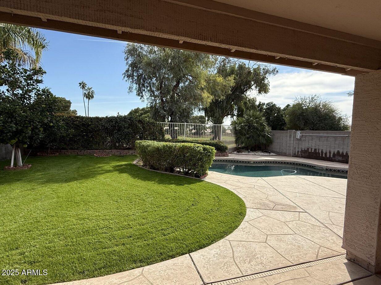 6079 West Irma Lane Glendale, AZ 85308 - Photo 6 of 33 a view of swimming pool with a garden