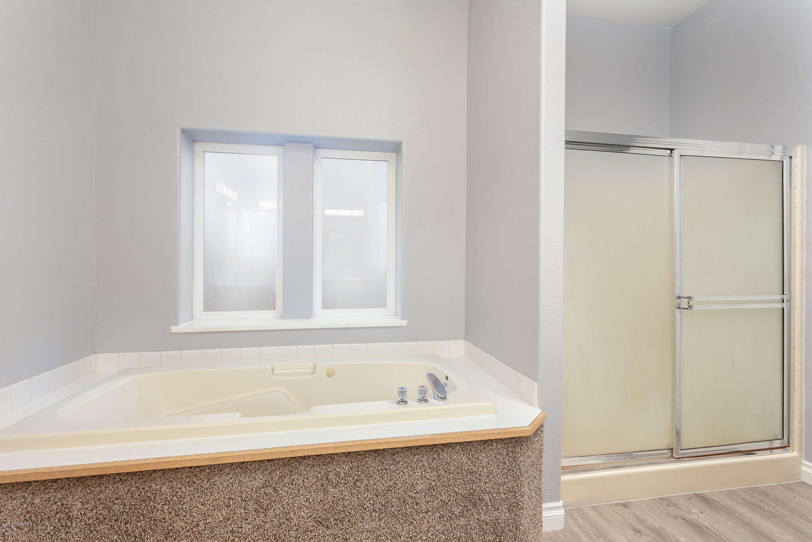 1361 Highschool Road Mabton, WA 98935 - Photo 14 of 24 a bathroom with a bathtub and a shower