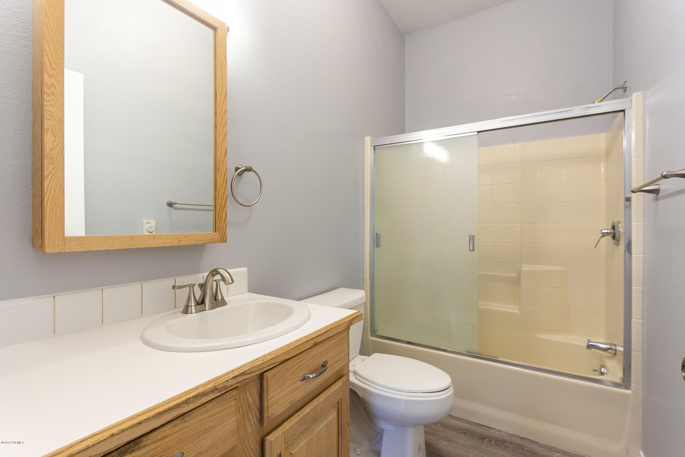1361 Highschool Road Mabton, WA 98935 - Photo 20 of 24 a bathroom with a sink toilet and shower