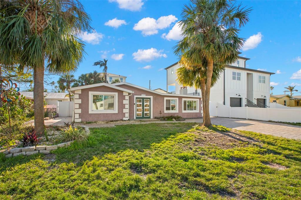 16208 3rd Street East Redington Beach, FL 33708 - Photo 1 of 1 a front view of a house with garden