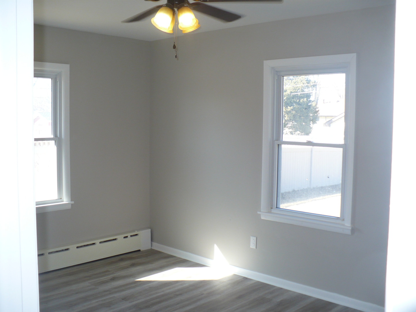 3125 Jo Ann Drive Joliet, IL 60431 - Photo 15 of 16 an empty room with wooden floor and windows