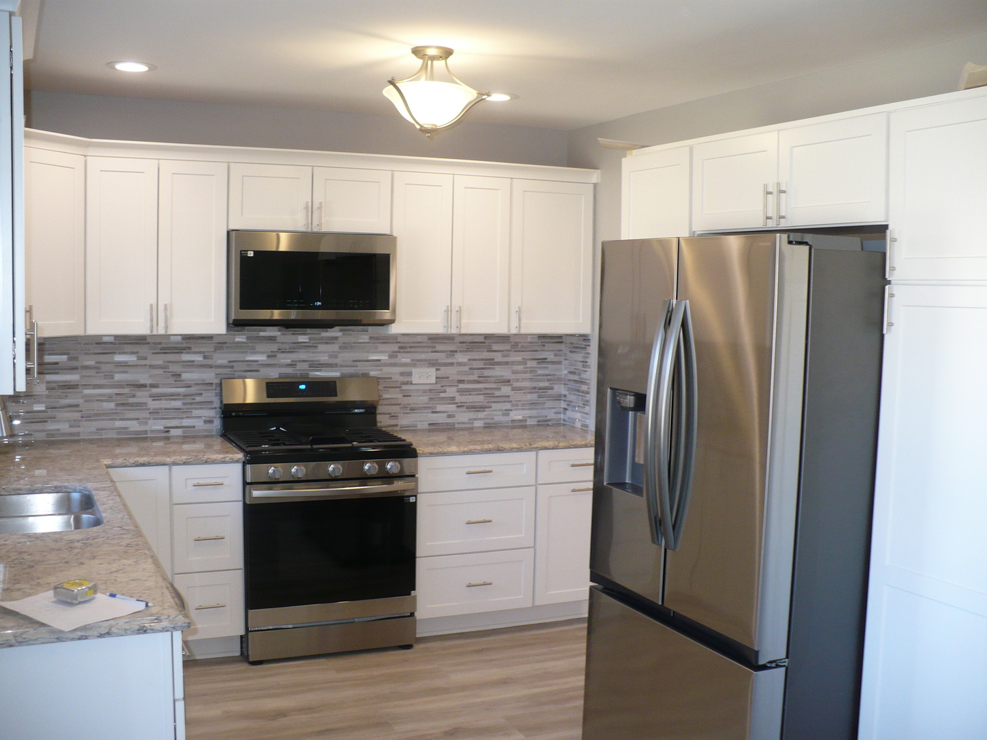 3125 Jo Ann Drive Joliet, IL 60431 - Photo 4 of 16 a kitchen with a refrigerator stove and microwave