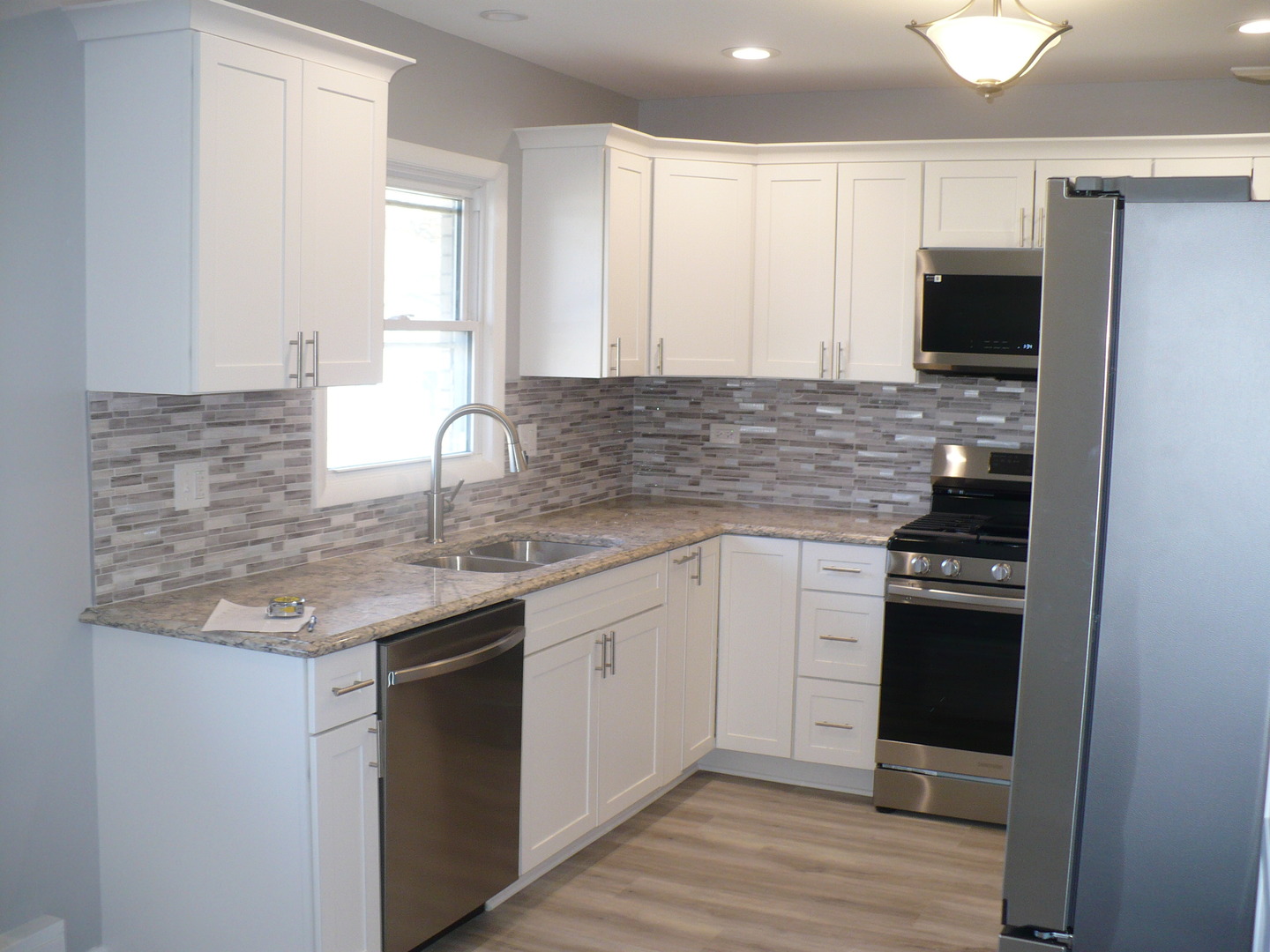 3125 Jo Ann Drive Joliet, IL 60431 - Photo 6 of 16 a kitchen with stainless steel appliances granite countertop a sink stove and refrigerator