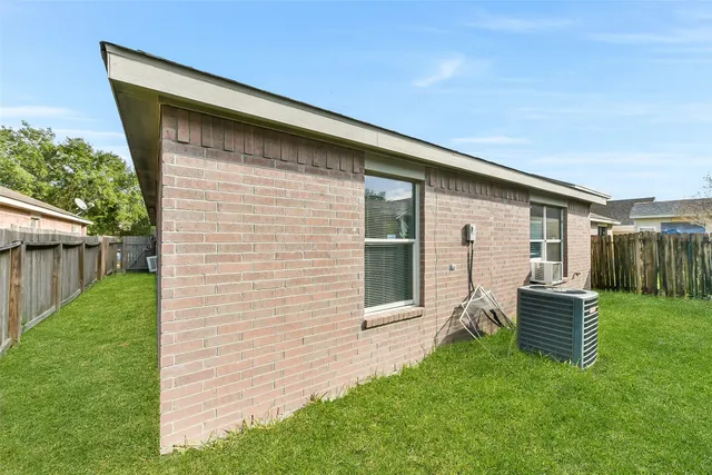 a backyard of a house with seating space