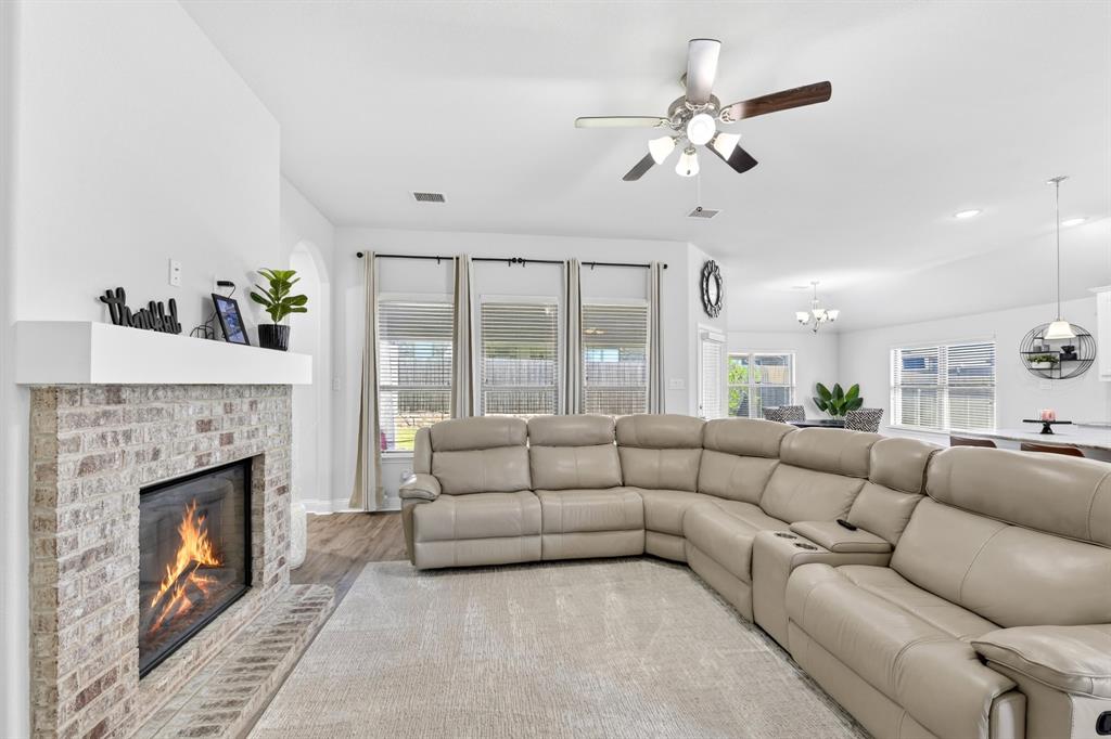 136 Gleeson Drive Red Oak, TX 75154 - Photo 21 of 40 a living room with furniture and a fireplace