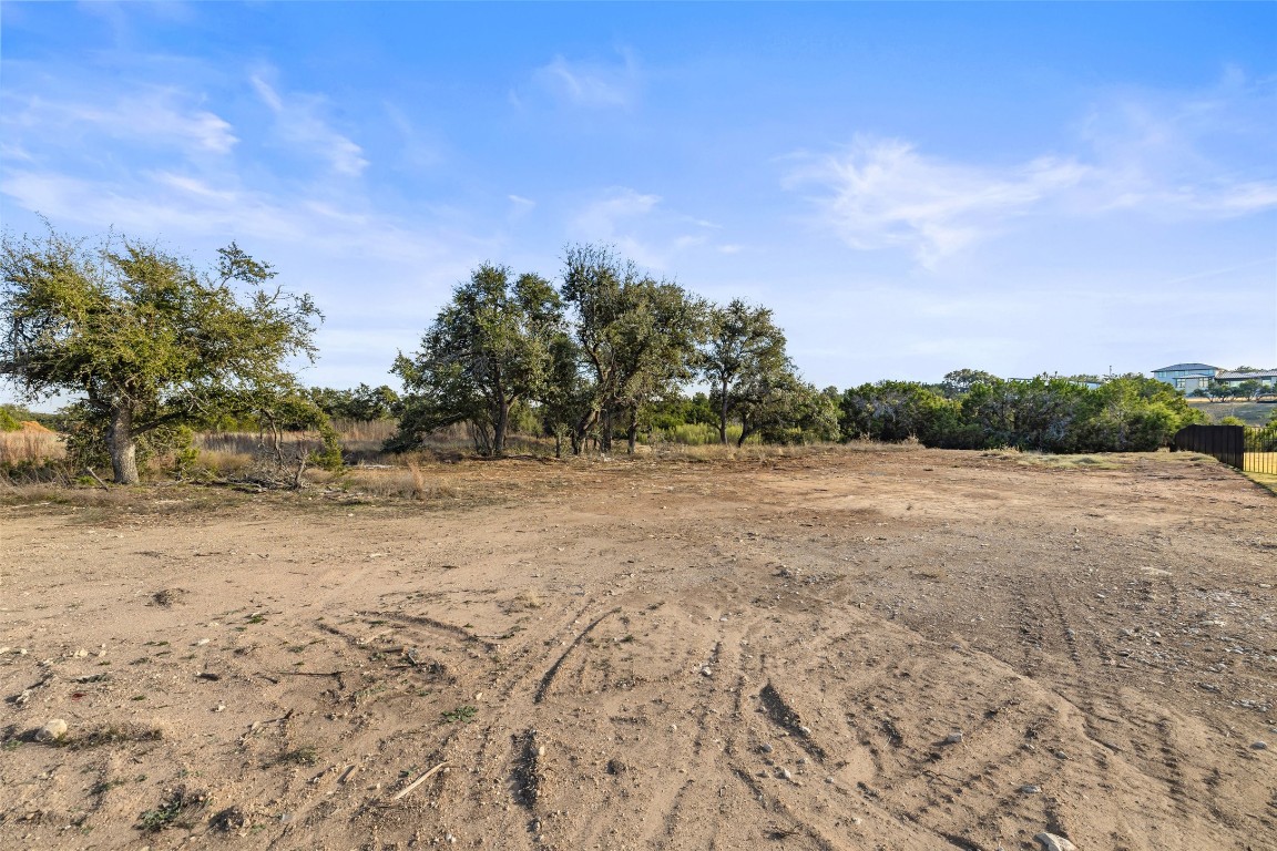 17105 Morning Grove Lane Austin, TX 78738 - Photo 12 of 21 a view of dirt field with trees in background