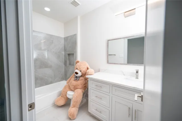 a bathroom with a sink and mirror