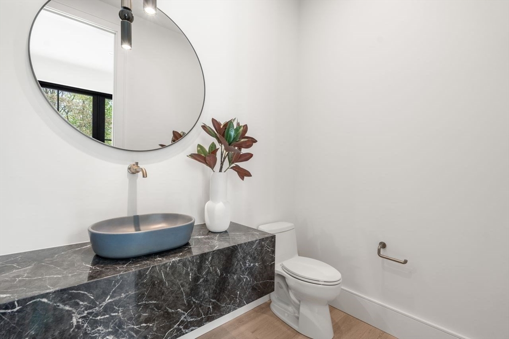 279 Fuller Street Newton, MA 02465 - Photo 13 of 42 a bathroom with a toilet and a mirror