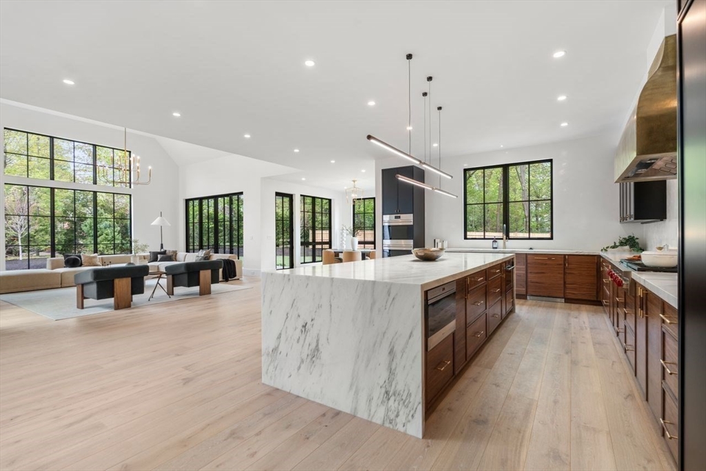 279 Fuller Street Newton, MA 02465 - Photo 14 of 42 a large kitchen with stainless steel appliances wooden floor and a large window
