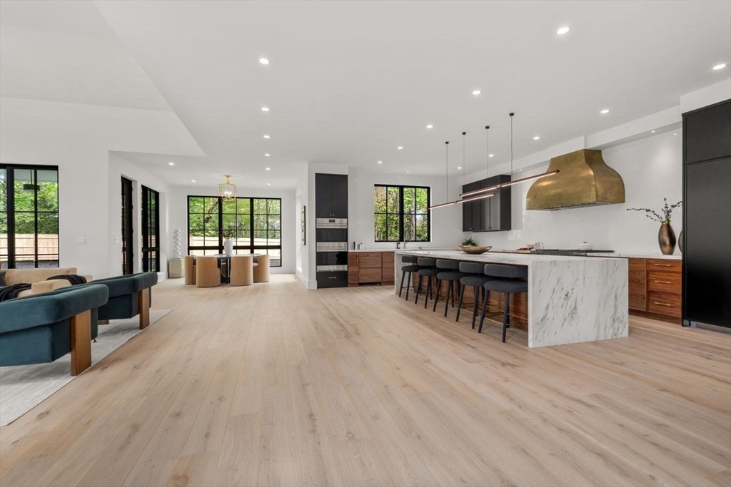 279 Fuller Street Newton, MA 02465 - Photo 21 of 42 a large kitchen with stainless steel appliances kitchen island granite countertop a large island in the center