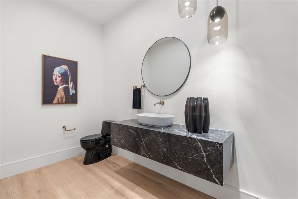 279 Fuller Street Newton, MA 02465 - Photo 26 of 42 a bathroom with a sink mirror and vanity