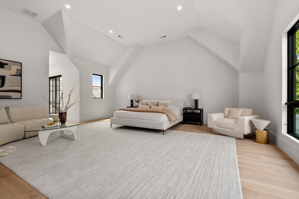 279 Fuller Street Newton, MA 02465 - Photo 30 of 42 a bedroom with furniture and wooden floor