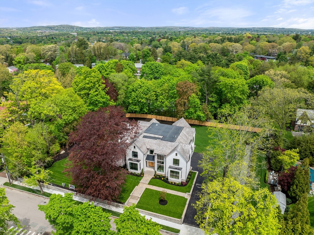 279 Fuller Street Newton, MA 02465 - Photo 3 of 42 an aerial view of a house with a garden