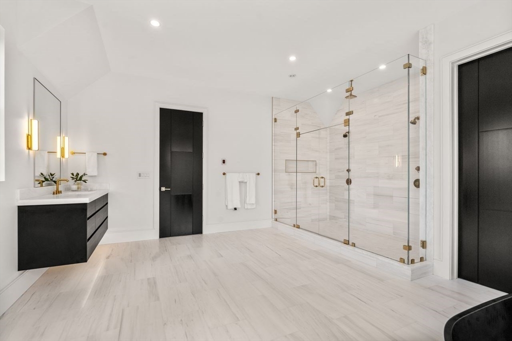 279 Fuller Street Newton, MA 02465 - Photo 36 of 42 a spacious bathroom with a shower and a sink