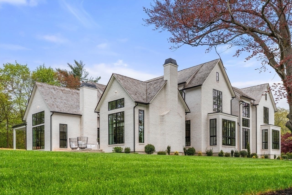 279 Fuller Street Newton, MA 02465 - Photo 39 of 42 a front view of a house with a yard and trees