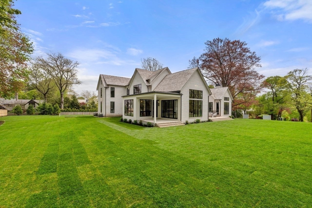 279 Fuller Street Newton, MA 02465 - Photo 41 of 42 a front view of a house with a garden