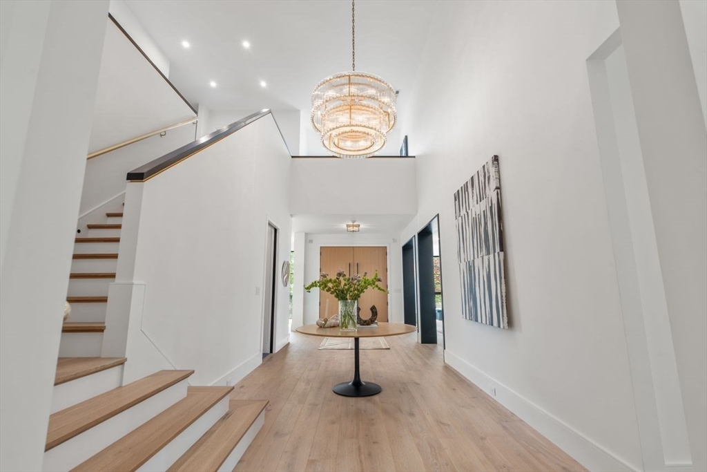 279 Fuller Street Newton, MA 02465 - Photo 5 of 42 a view of entryway and hall with wooden floor