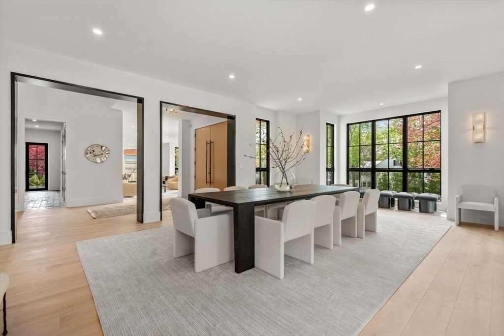 279 Fuller Street Newton, MA 02465 - Photo 9 of 42 an open kitchen with granite countertop a stove and white cabinets