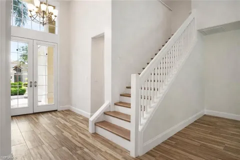 a view of entryway with wooden floor