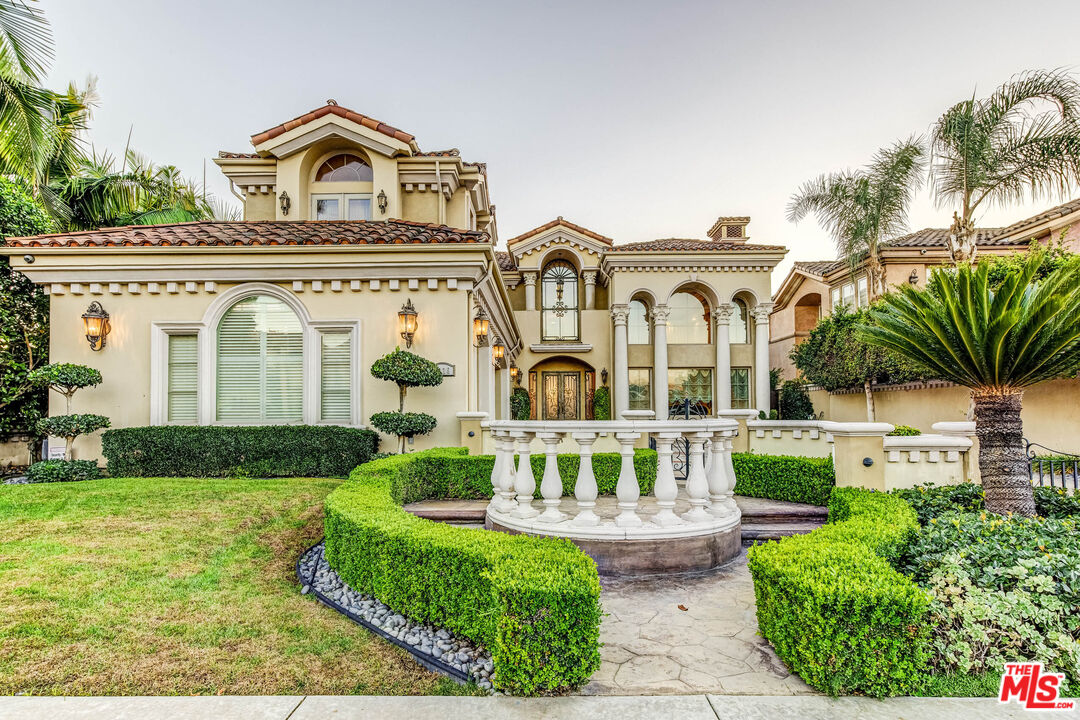 8336 Lexington Road Downey, CA 90241 - Photo 1 of 49 a front view of a house with garden