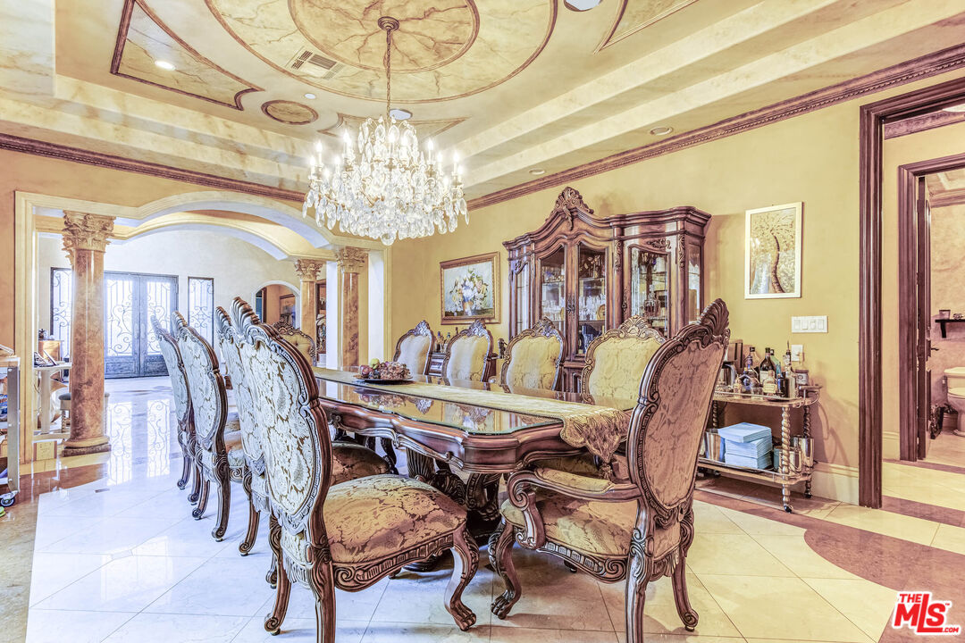 8336 Lexington Road Downey, CA 90241 - Photo 11 of 49 a view of a dining room with furniture and chandelier