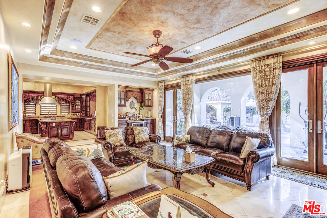 8336 Lexington Road Downey, CA 90241 - Photo 16 of 49 a living room with furniture a chandelier