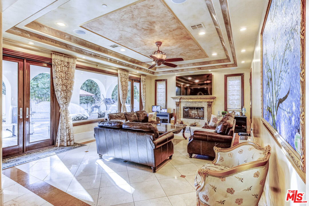 8336 Lexington Road Downey, CA 90241 - Photo 17 of 49 a living room with furniture and a fireplace