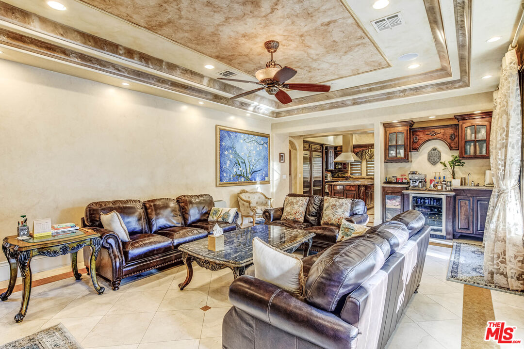 8336 Lexington Road Downey, CA 90241 - Photo 18 of 49 a living room with furniture and a chandelier