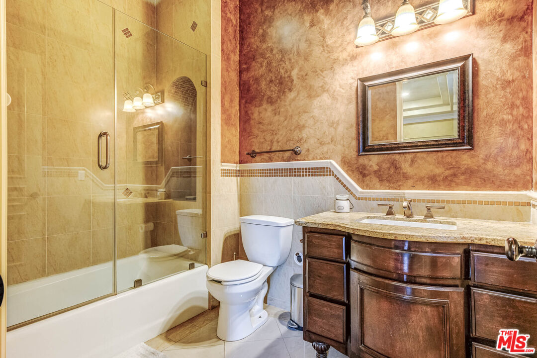 8336 Lexington Road Downey, CA 90241 - Photo 21 of 49 a bathroom with a sink a toilet and shower