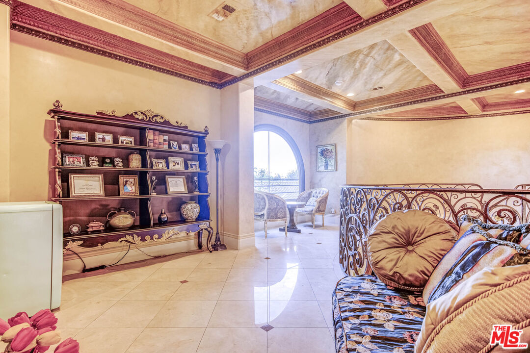8336 Lexington Road Downey, CA 90241 - Photo 24 of 49 a living room with a couch and a book shelf