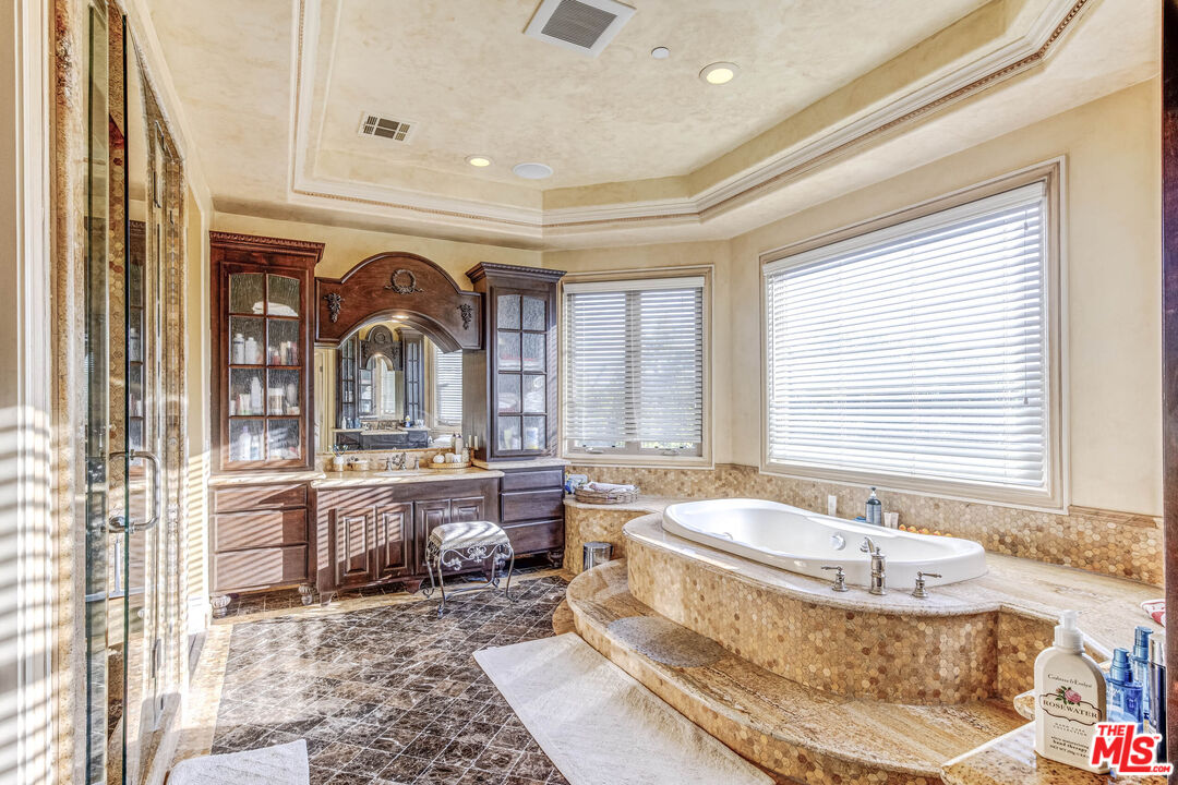 8336 Lexington Road Downey, CA 90241 - Photo 29 of 49 a spacious bathroom with a granite countertop tub and a sink