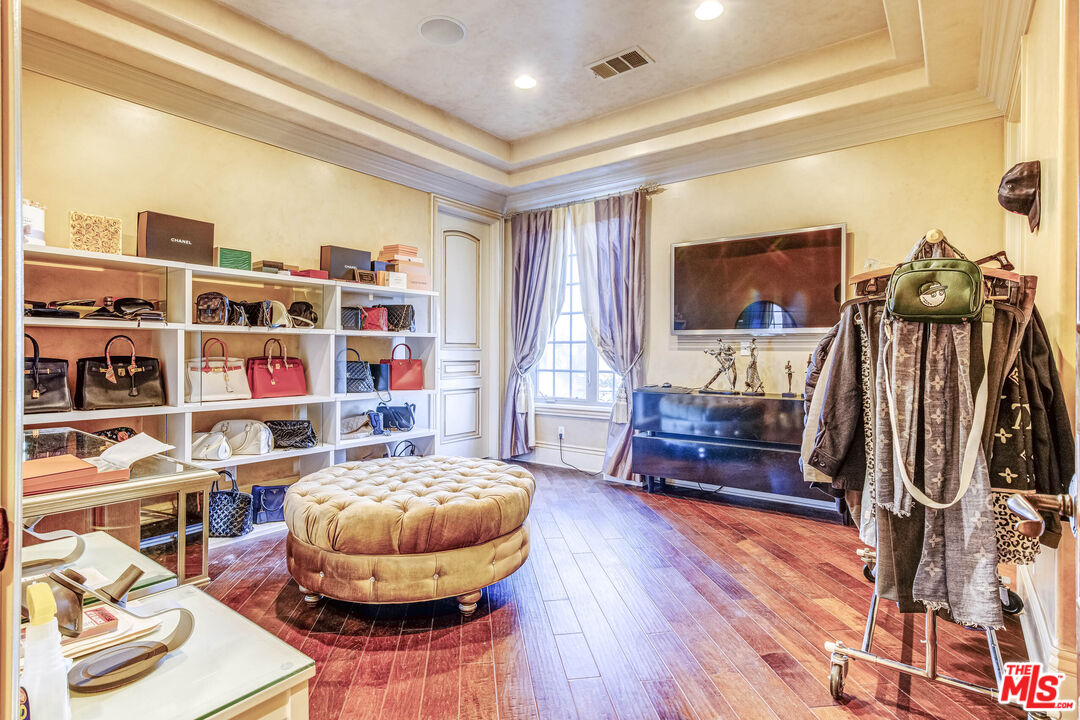 8336 Lexington Road Downey, CA 90241 - Photo 34 of 49 a living room with furniture and a flat screen tv