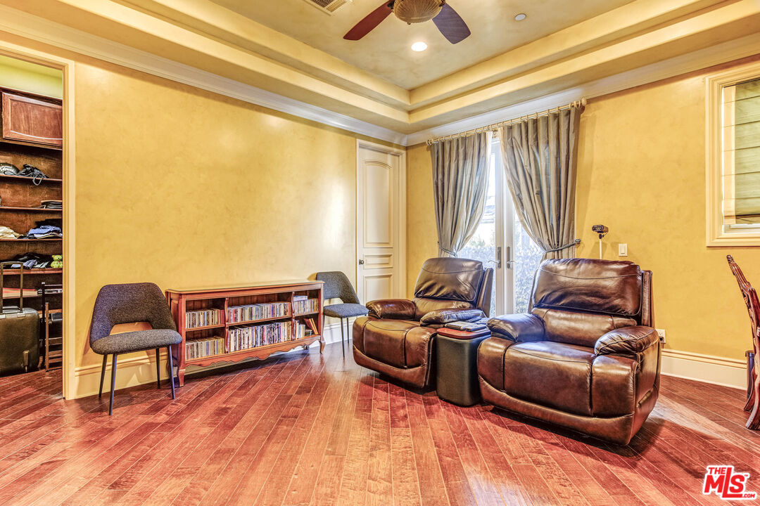 8336 Lexington Road Downey, CA 90241 - Photo 35 of 49 a living room with furniture and a wooden floor