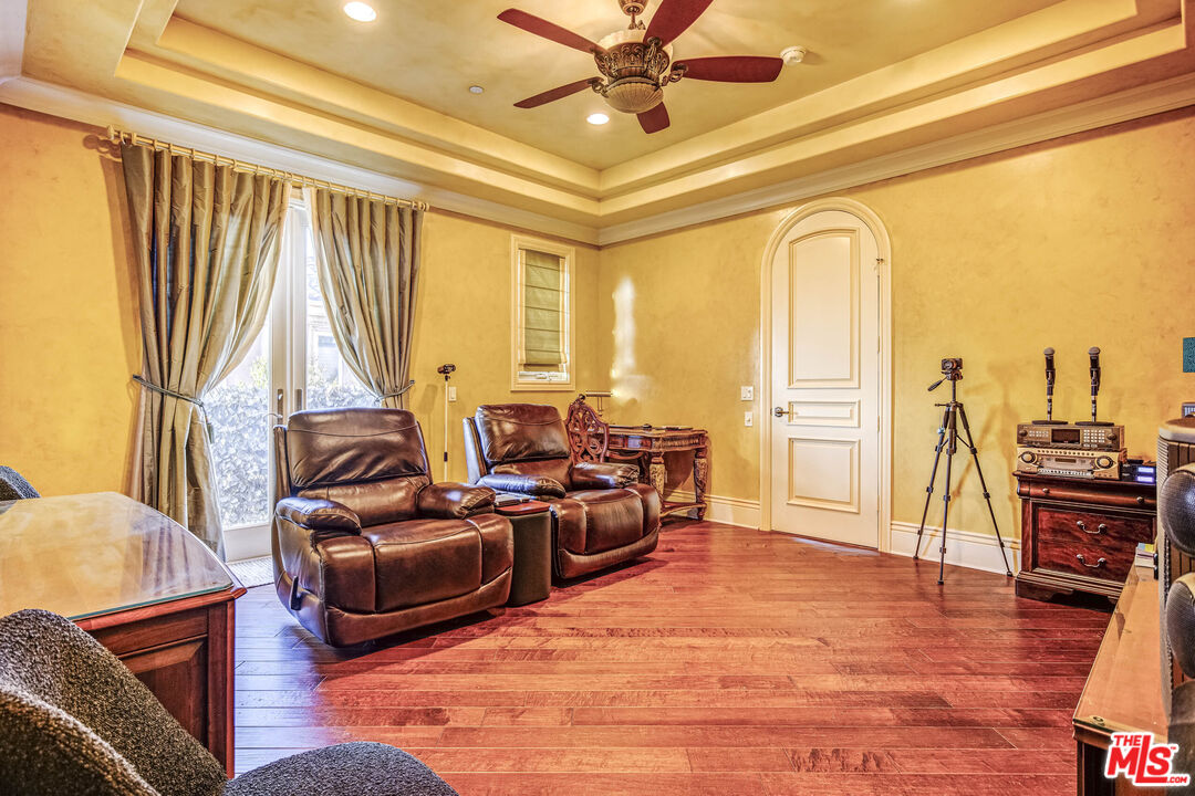 8336 Lexington Road Downey, CA 90241 - Photo 36 of 49 a living room with furniture and a wooden floor