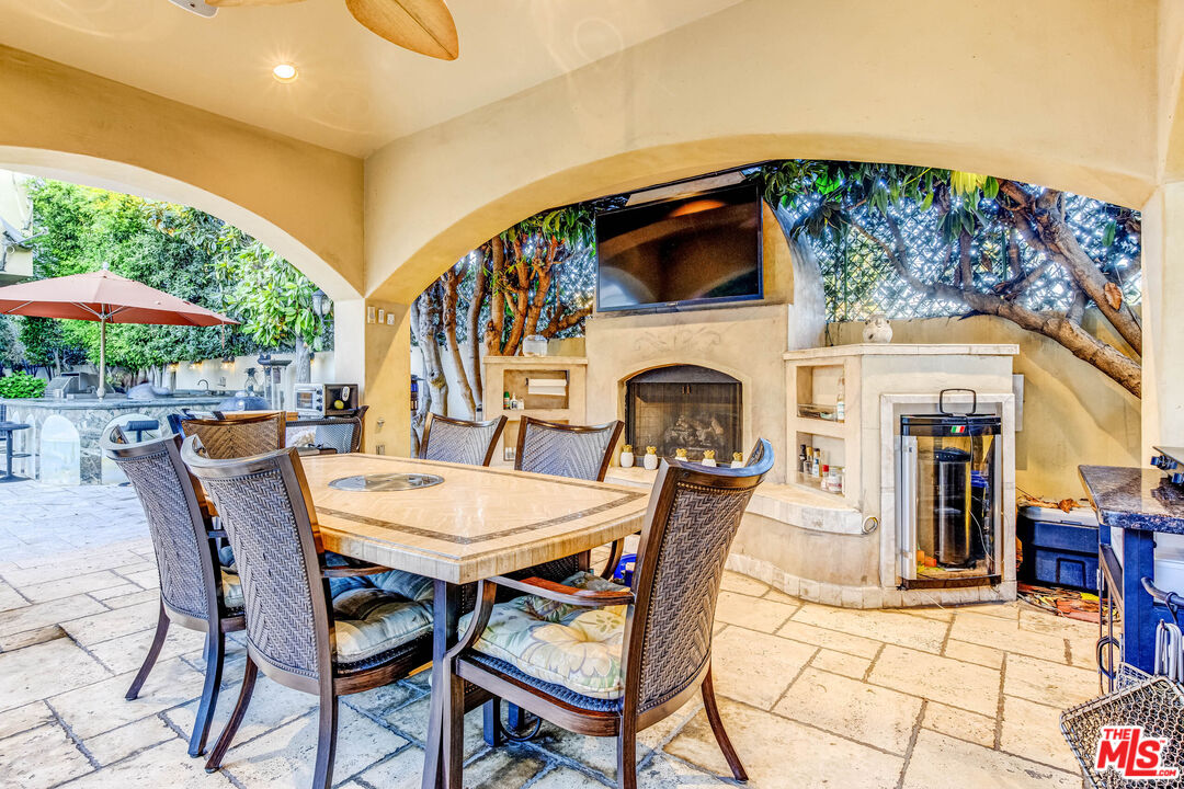 8336 Lexington Road Downey, CA 90241 - Photo 38 of 49 a view of a dining table and chairs in the patio