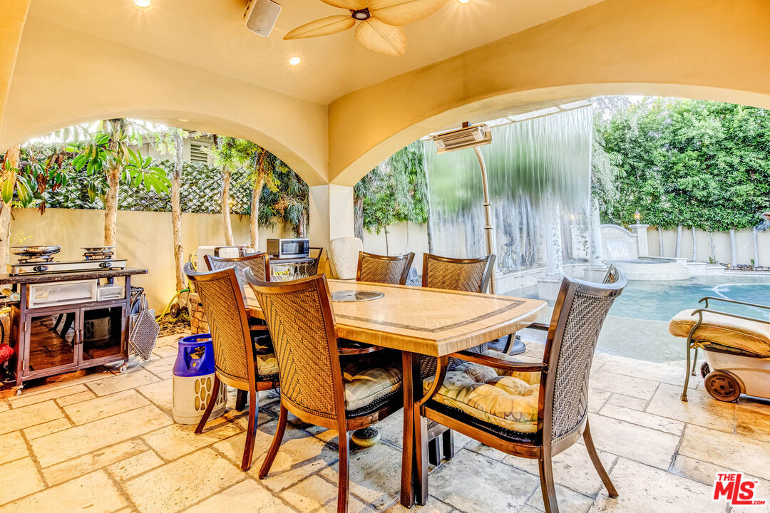 8336 Lexington Road Downey, CA 90241 - Photo 39 of 49 a view of an outdoor dining space with a table and chairs