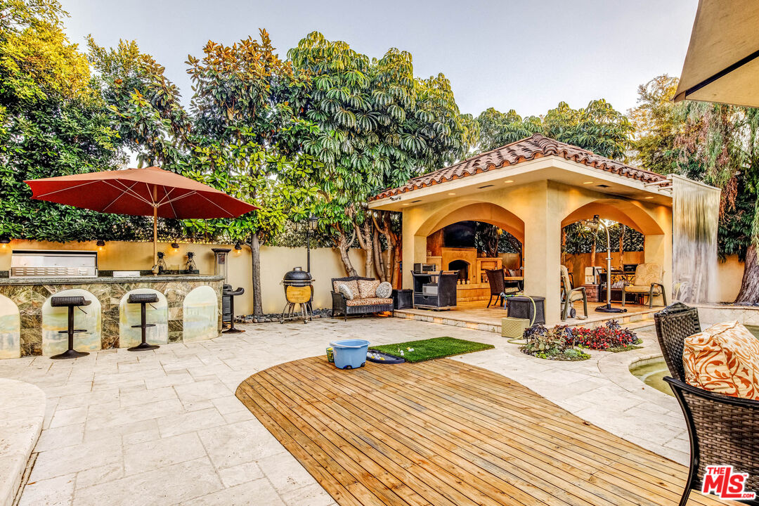 8336 Lexington Road Downey, CA 90241 - Photo 40 of 49 a view of a dinning table and chairs in the patio