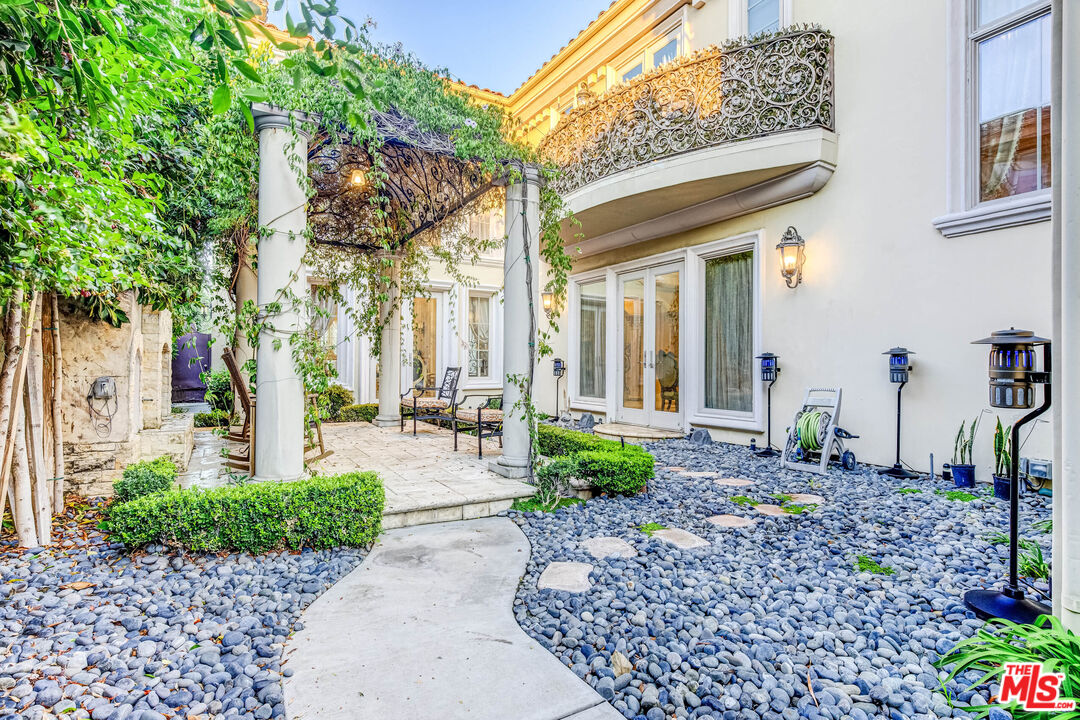 8336 Lexington Road Downey, CA 90241 - Photo 46 of 49 a front view of a house with garden