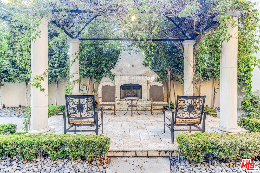 8336 Lexington Road Downey, CA 90241 - Photo 48 of 49 a patio with table and chairs and potted plants