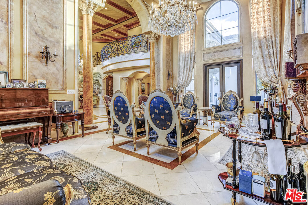 8336 Lexington Road Downey, CA 90241 - Photo 6 of 49 a view of living room filled with furniture and a chandelier