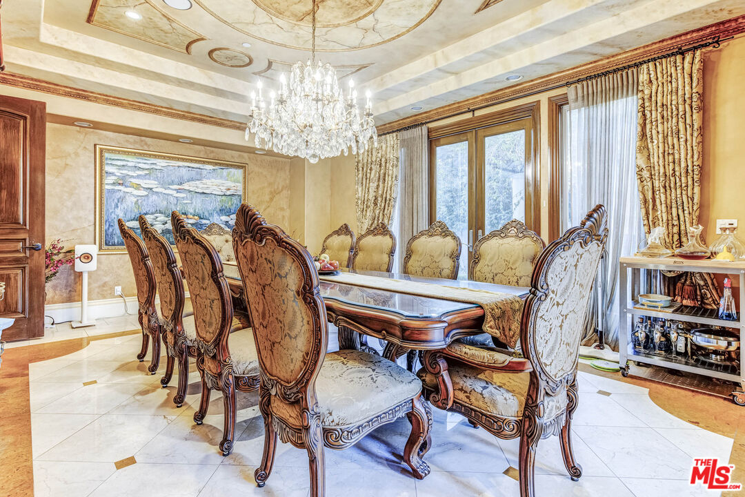 8336 Lexington Road Downey, CA 90241 - Photo 9 of 49 a dining room with furniture chandelier and wooden floor